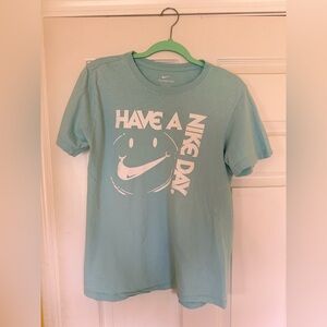 Light teal Nike graphic tee w|smiley swoosh design. Super soft and comfortable.